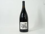 a bottle of wine that is sitting on a table