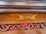 a close up of a wooden cabinet with a sign on it