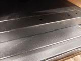a laptop computer sitting on top of a wooden table