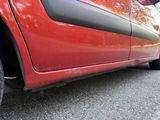 a red car parked on the side of the road