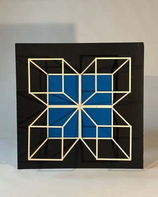 blue and white geometric design on a black background
