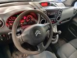 a car dashboard with a steering wheel and a dash light