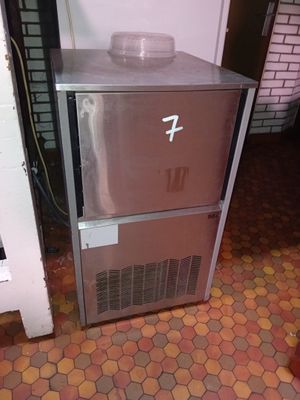 an image of a stainless steel refrigerator in a kitchen