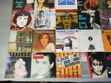 a lot of different album covers on a table