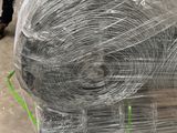 a large roll of wire wrapped in plastic on a pallet