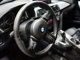 a steering wheel and dashboard of a car in a car showroom