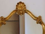 a mirror that is sitting on the wall in the room