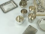 a box with silver items on a white table