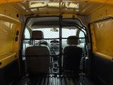 two people sitting in the back of a van