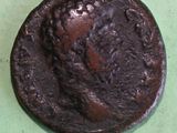 an old coin with a picture of a woman on it