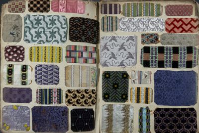an open book that has many different patterns on it