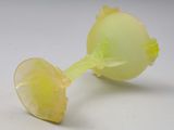 a broken apple sitting on a table with a white background