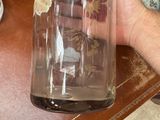 a person holding a bottle of water on a table