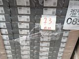a large stack of boxes with a price tag on them
