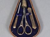 a case with a pair of scissors and a knife in it