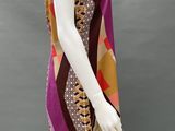an image of a mannequin wearing a colorful dress and hat