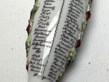 a picture of a bottle that has been decorated with words