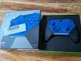 xbox wireless controller in a box on a wooden table