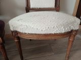 a white chair with a white blanket on it
