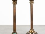 pair of antique brass candlesticks with green glass inserts