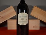 a bottle of wine that is sitting on a table