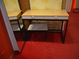 a small desk with a mirror on it in a room