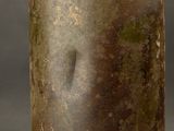 a close up of a brown bottle with a brown label on it
