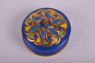 une boîte bleue ornée d'un motif bleu et doré