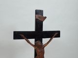 a statue of jesus on the cross on a table