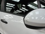 a white car that is parked in a garage
