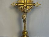 brass crucif with jesus on the cross on a white background