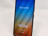 a close up of a cell phone with a welcome screen on it