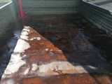a truck that has rust on the bed of it
