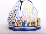 a blue and white vase with a fish design on it