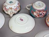 six different types of china plates and bowls on the table