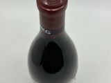a bottle of wine that is sitting on a table