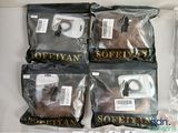 four bags of coffee beans are sitting on a table