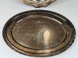 a silver tray with a silver lid sitting on a table
