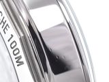 a close up of a clock on a white surface