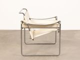 an image of a white leather chair with a metal frame