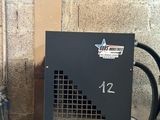 a black box with a number on it next to a water heater