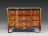 an antique chest of drawers with marble top