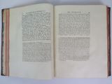 an open book with a picture of a man on it