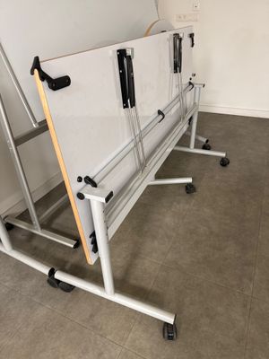 a white board sitting on top of a white table