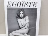 a magazine sitting on top of a table next to a basket