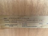 a close up of a label on the back of a wooden cabinet