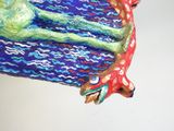 a figurine of a dog laying on a blanket