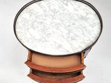 an image of a round marble top table with a wooden base