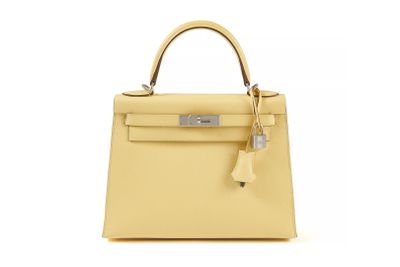 a yellow leather handbag on a white background