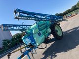 a close up of a blue tractor with a crane attached to it